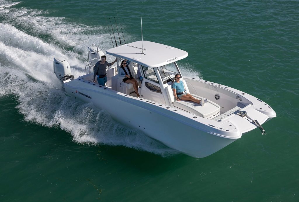 Twin Vee 280 GFX2 running offshore with fishing poles.