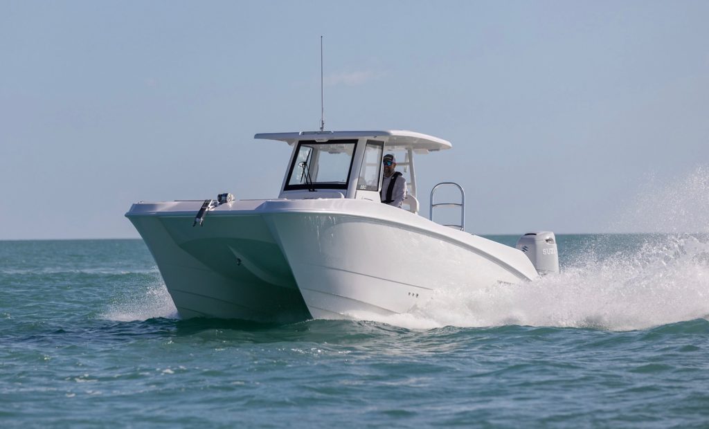 Twin Vee 280 GFX2 power catamaran running on the ocean.