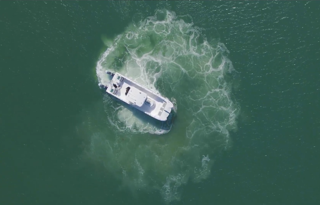 Twin Vee 340 GFX maneuvering a 360 degree turn in open water.